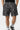 Maillot de bain Jibby Noir imprimé cachemire blanc, plan rapproché de face, cordon blanc et poches latérales
