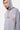 Sweat à capuche Evy Gris Chiné en gros plan sur mannequin homme, cordons rayés rose et blanc, trois cœurs sur la manche