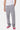 Jogging Jill Gris Chiné porté de face par un mannequin homme avec t-shirt blanc, coupe droite, baskets roses et vertes