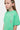T-shirt Jilona Vert porté par une fille, vue de trois quarts en gros plan, cœurs à croix alignés sur le côté gauche