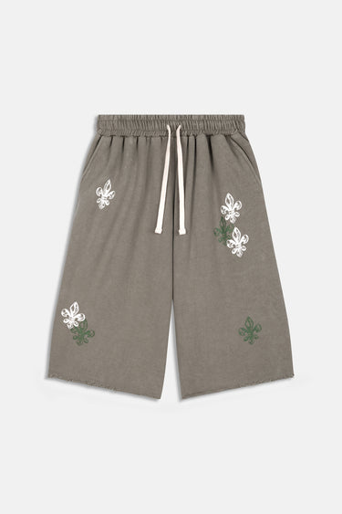 Short Jiora Kaki à plat, vue de face, cordon écru et motifs de fleurs de lys blancs et verts brodés