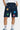 Short cargo Jolan Denim Bleu en gros plan porté, poches à rabat boutonnées, cordon bleu et fleurs colorées brodées