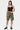 Short cargo Jolan Kaki porté par une mannequin femme avec top noir, fleurs colorées, chaussettes blanches, vue de face
