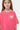 T-shirt Joselia Rose porté par une fille, gros plan de face, cœur blanc zébré et inscription No Snitch We Love Amour