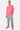 T-shirt Joums Rose porté par un mannequin homme avec jogging gris, vue de face en pied, baskets roses, broderie Eleven rouge
