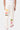 Jogging Joviel Écru vu de dos porté par un mannequin, patchs colorés sur les jambes, baskets roses et blanches