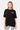 T-shirt Joy Noir oversize porté de face par une mannequin femme, petite inscription Parisian Tour No Snitch, legging zèbre