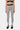 Legging de sport Jet Zèbre vu de face, motif zèbre noir et blanc, ceinture noire à logo cœur, baskets noires