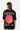 T-shirt Juicy Noir oversize porté de dos par une mannequin femme, fleur rose souriante et inscription Eleven Records