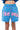 Short Julie Bleu en molleton porté par un enfant, inscription Eleven gothique rose, cordon bicolore et bas effiloché