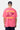 T-shirt June Rose porté de dos par un mannequin homme avec casquette noire, Kinder Planet jaune, cœur planète bordeaux