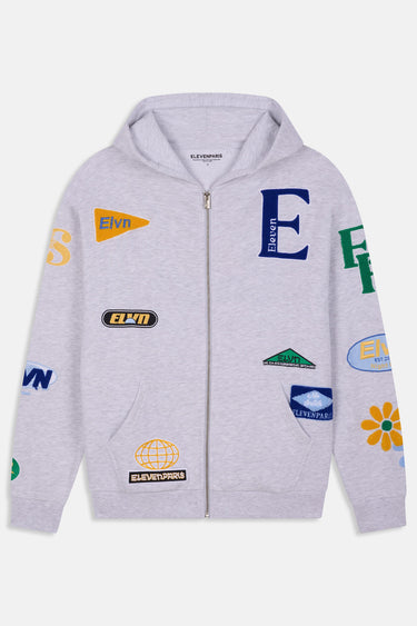 Sweat à capuche zippé Jungle Gris Chiné vu de face à plat, patchs fanion Elvn, globe, lettre E bleue et fleur