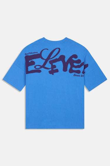 T-shirt Juno Bleu oversize vu de dos à plat, grand lettrage Eleven violet et mention Since 2012, fond blanc