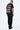 T-shirt Lys Noir delavé porté par un mannequin homme avec pantalon cargo, dos et inscription Another Fucking Bonjour