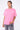 T-shirt Lys Rose délavé porté par une mannequin femme avec jean gris à fleur de lys, vue de face, inscription blanche