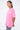 T-shirt Lys Rose délavé porté par une mannequin femme, vue de profil avec inscription blanche Maison Elevenparis factory