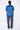 T-shirt Lys Bleu délavé porté par une mannequin femme avec pantalon cargo gris, vue de dos en pied et inscription claire