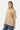 T-shirt Lys Beige porté par une mannequin femme avec jean, vue de trois quarts face et inscription marron sur la poitrine