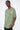 T-shirt Lys Kaki délavé porté par un mannequin homme, vue de trois quarts face et inscription rose sur la poitrine