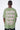 T-shirt Lys Kaki délavé porté par un mannequin homme, vue de dos avec inscription rose Another Fucking Bonjour Madame