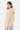 Sweat à capuche Moon Beige vu de dos et de profil, porté par une femme, capuche relevée sur les épaules