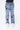 Jean Neleo Bleu jean porté de face par un enfant, patchs fleur de lys noirs sur les cuisses et le genou