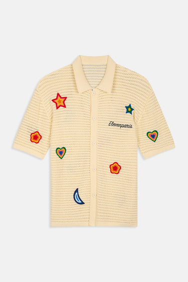 Polo en maille Joly Écru ajourée à plat, vue de face, boutons, broderies d'étoiles, de coeurs et de lune colorés