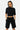Short Palma Noir porté par une mannequin femme avec t-shirt court noir, poches latérales et logo ELEVENPARIS gris
