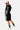 Sweat à capuche court Pamela Noir et short assorti vus de profil, bandes de fleurs colorées sur les manches et la jambe