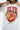 T-shirt Pasly Écru porté, zoom sur l'impression pêche souriante sous ELVN rouge et inscription Life is a joke