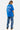 T-shirt Peams Bleu délavé porté par une mannequin femme de dos avec jean à coeurs, inscription Heart Director Hotline