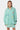 Chemise Penelope Vert à rayures blanches portée par une mannequin femme de face, écussons papillon, citron et coeur brodés