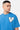 T-shirt Pinerolo Bleu porté par un mannequin homme avec chaîne argentée, zoom sur le coeur souriant en mosaïque
