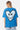 T-shirt Pinerolo Bleu porté par une mannequin femme de dos, grand coeur souriant en mosaïque bleu clair et noir