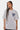 T-shirt Pinerolo Blanc coupe ample porté par une mannequin femme aux tresses, vue de face, coeur souriant bleu gris