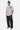 T-shirt Pinerolo Blanc porté par un mannequin homme en bonnet bleu et pantalon cargo noir, vue de face en pied
