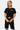 T-shirt court Plume Noir porté par une mannequin femme avec short cargo noir, vue de face, inscription New York