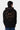 Sweat à capuche Poncho Noir porté par un mannequin homme de dos, smiley No Snitch motif léopard et inscription sur la capuche