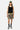 Short de bain Porquerolles Camouflage porté en pied par un mannequin homme, débardeur noir, casquette kaki et baskets
