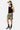 Short de bain Porquerolles Camouflage porté par un mannequin homme, de profil, avec débardeur noir et casquette kaki