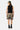 Short de bain Porquerolles Camouflage porté par un mannequin homme, vu de dos, débardeur noir et baskets