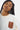 T-shirt Power Écru, plan rapproché sur un mannequin femme, poche écusson terracotta avec cœur gravé