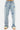 Jean Pretty Bleu Clair porté par un mannequin, de face en plan large, fleurs de lys brodées bleues et blanches