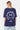 T-shirt Punky Bleu Marine porté par un mannequin femme, de dos, smiley en lettrage gothique Elevenparis et triangle