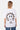 T-shirt Punky Blanc porté par un mannequin femme, de dos, smiley en lettrage gothique léopard, No Snitch et triangle