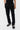Pantalon cargo Suede Noir porté de face, plan taille et jambes, boutons-pressions chromés aux chevilles