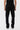 Pantalon cargo Suede Noir porté vu de dos par un mannequin, poches arrière à rabat et petit coeur brodé
