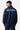 Veste zippée Taren Bleu Marine portée vue de dos par un mannequin, inscription ELEVEN gothique et fleurs de lys bleues