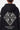 Gilet zippé à capuche Tasmanie Noir en maille, zoom sur le dos, motif losange Elevenparis et étoiles sur la manche