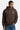 Sweat à capuche Tevy Marron porté par un homme, de face, cordons rayés, cœur écru et jean à fleurs de lys